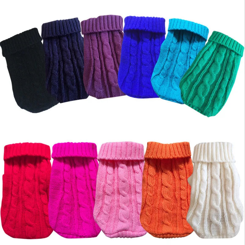 Cable knit dog sweaters arranged in assorted colors