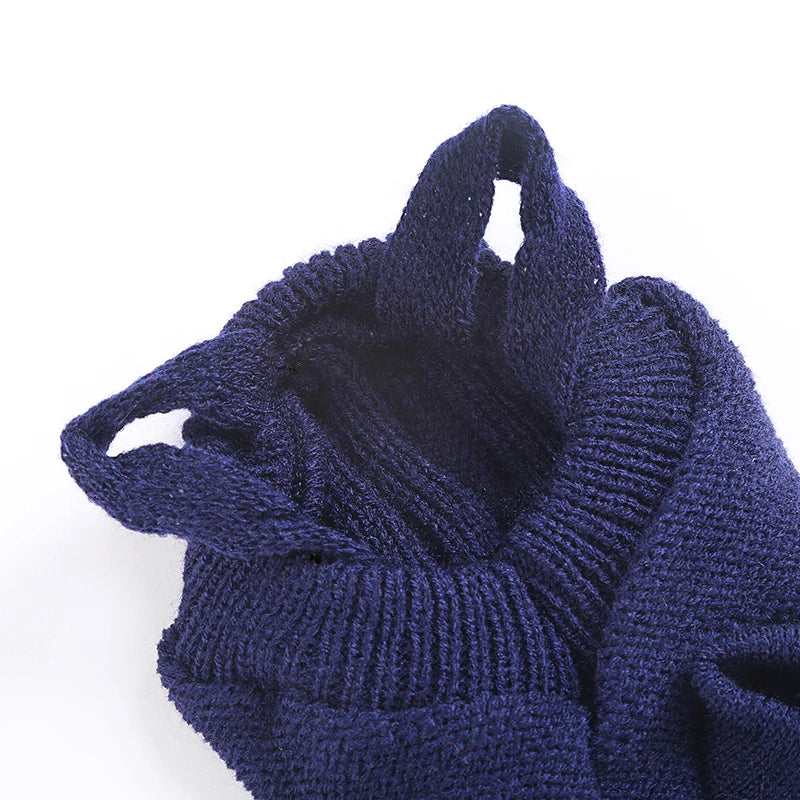 Close-up of navy dog sweater knit, ribbing, and openings
