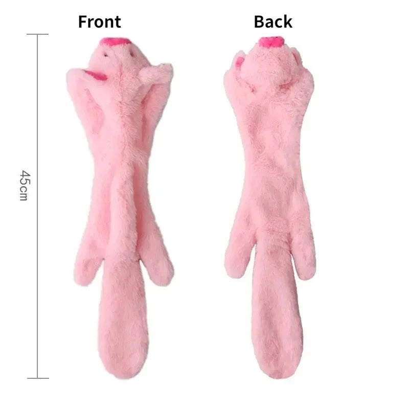 Front and back views of a pink pig plush dog toy