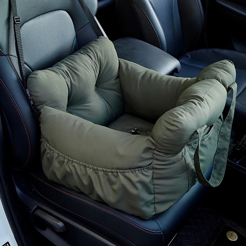 Olive green padded dog car bed installed on a front seat
