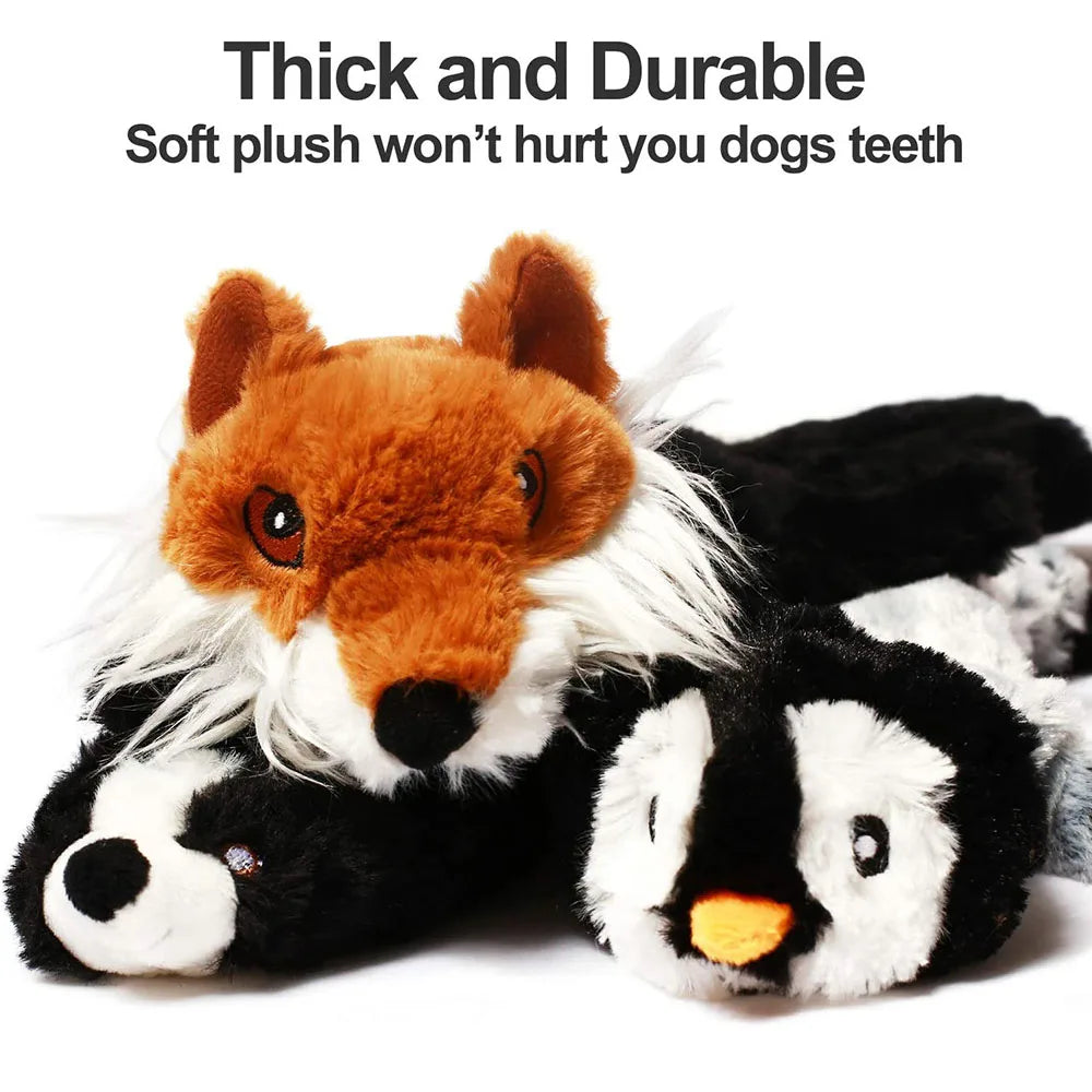 Close-up of fox and skunk plush dog toy faces