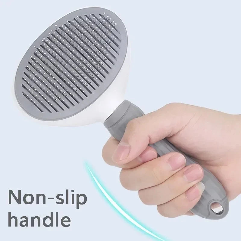 Hand holding the gray slicker brush by its textured handle.